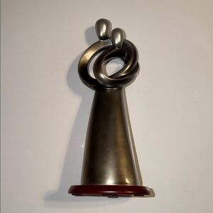Silver Abstract Sculpture Representing a Hugging Couple.  Colored Resin 12” High